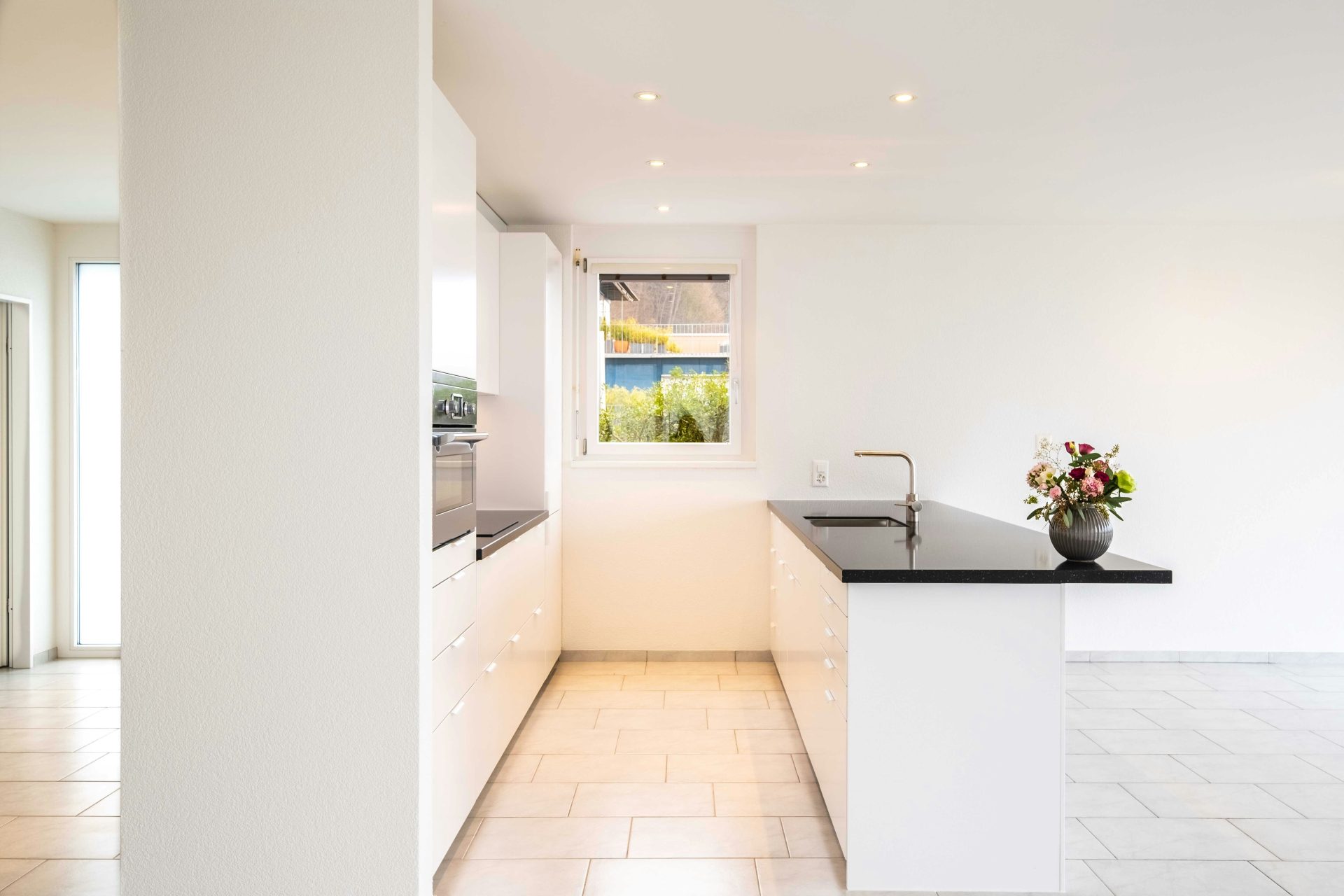 white ceramic bathtub near white wall